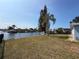 Backyard featuring mature trees and waterfront access at 6522 Nautical Isle, Hudson, FL 34667