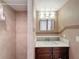 Bathroom featuring vanity, sink, mirror, and shower at 6522 Nautical Isle, Hudson, FL 34667