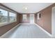 Living room with tile floors offers plenty of natural light and access to a back door at 6522 Nautical Isle, Hudson, FL 34667