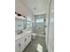 Modern bathroom featuring a glass enclosed shower, white vanity, and stylish fixtures at 6526 1St S Ave, St Petersburg, FL 33707