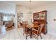 Traditional dining room with wood table and china cabinet, chandelier, and tile floors at 7215 121St Ter, Largo, FL 33773