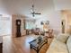 Spacious living room features wood floors, vaulted ceiling, and ceiling fan at 7215 121St Ter, Largo, FL 33773