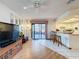 Bright living area with sliding glass doors to the patio, open to the kitchen and dining area at 7215 121St Ter, Largo, FL 33773