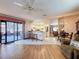 Open living area with slider to patio, connecting kitchen, dining, and living spaces at 7215 121St Ter, Largo, FL 33773