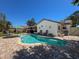 Sparkling pool surrounded by brick pavers, with seating and lush landscaping, creating a private backyard oasis at 7215 121St Ter, Largo, FL 33773
