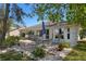 This home features a paver patio with table and chairs in a landscaped yard at 7305 Sugarbush, Spring Hill, FL 34606