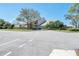 Community clubhouse featuring manicured lawns, shade trees and ample parking at 7305 Sugarbush, Spring Hill, FL 34606