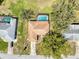 Aerial view of the home's roof and screened in pool at 8367 Apple Orchard Rd, Spring Hill, FL 34608