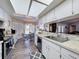 Well-lit kitchen with a view of breakfast nook and modern appliances at 8367 Apple Orchard Rd, Spring Hill, FL 34608