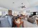 Bright living room with vaulted ceilings, comfortable seating, and natural light at 8367 Apple Orchard Rd, Spring Hill, FL 34608