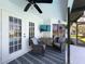 Inviting patio featuring ceiling fan, television, outdoor furniture, and exterior access at 8367 Apple Orchard Rd, Spring Hill, FL 34608