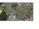 Aerial view of the neighborhood and surrounding golf course, area is marked in red at 8501 Hunting Saddle Dr, Hudson, FL 34667