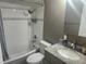 Updated bathroom featuring a shower-tub combo with subway tile and modern vanity at 8501 Hunting Saddle Dr, Hudson, FL 34667