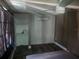 Cozy bedroom with a ceiling fan and mini-split air conditioner at 8501 Hunting Saddle Dr, Hudson, FL 34667