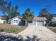 Single-story home with mature landscaping, providing excellent curb appeal and a welcoming entrance at 8501 Hunting Saddle Dr, Hudson, FL 34667