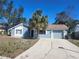 Inviting single-Gathering home with a well-manicured lawn and a convenient attached garage at 8501 Hunting Saddle Dr, Hudson, FL 34667