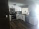 Well-appointed kitchen with stainless steel appliances, white cabinetry, and modern countertops at 8501 Hunting Saddle Dr, Hudson, FL 34667