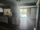 Bright kitchen offering a glimpse of the inviting pool area, perfect for indoor-outdoor living at 8501 Hunting Saddle Dr, Hudson, FL 34667