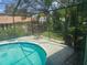 Inviting screened-in pool area, perfect for relaxing and enjoying outdoor living with comfortable seating at 8501 Hunting Saddle Dr, Hudson, FL 34667