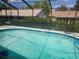 Inviting screened-in pool featuring a refreshing swimming area and a relaxing outdoor space at 8501 Hunting Saddle Dr, Hudson, FL 34667