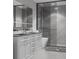Sleek bathroom with a dual sink vanity, large glass shower, and modern fixtures at 9024 Waterbird Way, Brooksville, FL 34613