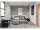 Contemporary bedroom featuring modern art, stylish lighting, and a comfortable lounging chair at 9024 Waterbird Way, Brooksville, FL 34613