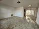 Open living room featuring neutral walls, carpet flooring, and sliding glass doors to back patio at 10803 Hachita Dr, Port Richey, FL 34668
