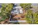 Aerial view of home showing the fenced backyard and surrounding mature landscaping at 11085 Maderia St, Spring Hill, FL 34609