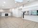 Bright living room with fireplace, built-in shelving, and natural light at 11085 Maderia St, Spring Hill, FL 34609