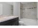 A bathroom featuring a vanity with a light-colored countertop and a shower and tub combination at 11192 Kodiak Wren Rd, Weeki Wachee, FL 34614
