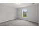Bedroom featuring neutral walls, carpet floor, and a window at 11192 Kodiak Wren Rd, Weeki Wachee, FL 34614