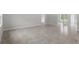 Expansive open-concept space highlighting modern tile flooring and neutral walls at 11192 Kodiak Wren Rd, Weeki Wachee, FL 34614