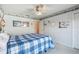 This bedroom features a lighthouse theme, ceiling fan, and bright, natural light at 11231 Sun Tree Rd, Hudson, FL 34667