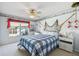 This nautical themed bedroom offers a cozy atmosphere with an array of seaside accessories at 11231 Sun Tree Rd, Hudson, FL 34667