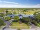 Aerial view of the community clubhouse with golf cart parking and manicured grounds at 11231 Sun Tree Rd, Hudson, FL 34667