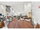 Large community dining area with light walls, modern lighting, dark wood tables and chair sets, and multiple seating arrangements at 11231 Sun Tree Rd, Hudson, FL 34667