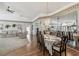 Bright dining room features hardwood floors, chandelier lighting, and connects to the living room at 11231 Sun Tree Rd, Hudson, FL 34667