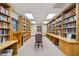 Organized library with extensive book collection and reading area at 11231 Sun Tree Rd, Hudson, FL 34667