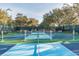 View of outdoor pickleball courts with green and blue surfaces at 11231 Sun Tree Rd, Hudson, FL 34667