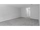 Spacious bedroom with neutral carpet, white walls, and ample natural light at 11388 Paramount Ave, Weeki Wachee, FL 34614
