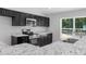 Bright kitchen featuring black cabinets, stainless steel appliances, and granite countertops at 11388 Paramount Ave, Weeki Wachee, FL 34614
