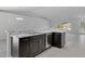 Kitchen island with granite countertop and stainless steel dishwasher at 11388 Paramount Ave, Weeki Wachee, FL 34614