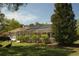 Screened-in lanai in a spacious backyard with ample seating and an area for grilling and outdoor entertaining at 11480 Emerald Ridge Ct, Spring Hill, FL 34609