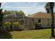 Enclosed backyard lanai offering a private outdoor space for relaxation and enjoyment of the surroundings at 11480 Emerald Ridge Ct, Spring Hill, FL 34609