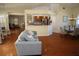 The living space has hardwood floors and an open floor plan with clear views of the kitchen and dining room at 11480 Emerald Ridge Ct, Spring Hill, FL 34609