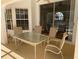 Enclosed patio with neutral outdoor table and chairs offers a relaxing space for outdoor entertaining and dining at 11480 Emerald Ridge Ct, Spring Hill, FL 34609