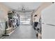 Organized garage with ample storage, bright lighting, and a functional space for parking and projects at 11526 Forest Run Ct, Port Richey, FL 34668