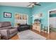 Inviting living room features comfy seating, a large window, and a media center with a flat-screen TV at 11526 Forest Run Ct, Port Richey, FL 34668
