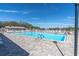 Community pool and deck offer a relaxing space for residents to enjoy the sun and water at 11526 Forest Run Ct, Port Richey, FL 34668