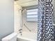 Bathroom featuring a shower with curtain, shower head, faucet, and toilet at 11917 Bayonet Ln # 11917, New Port Richey, FL 34654